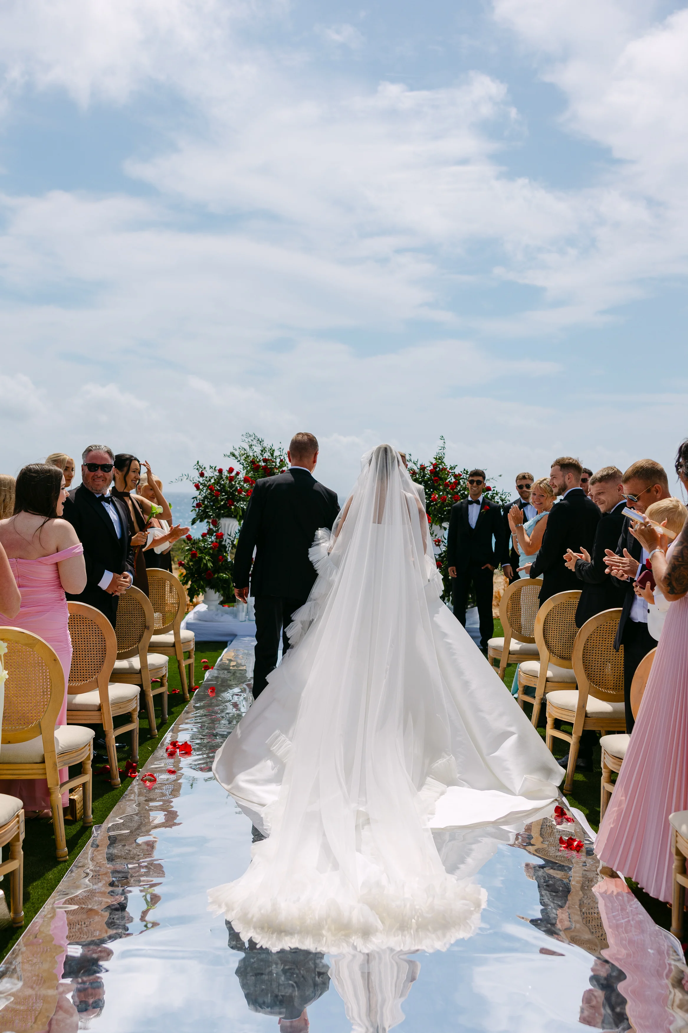Closer view of the bride and her father walking down the aisle at Ozea.